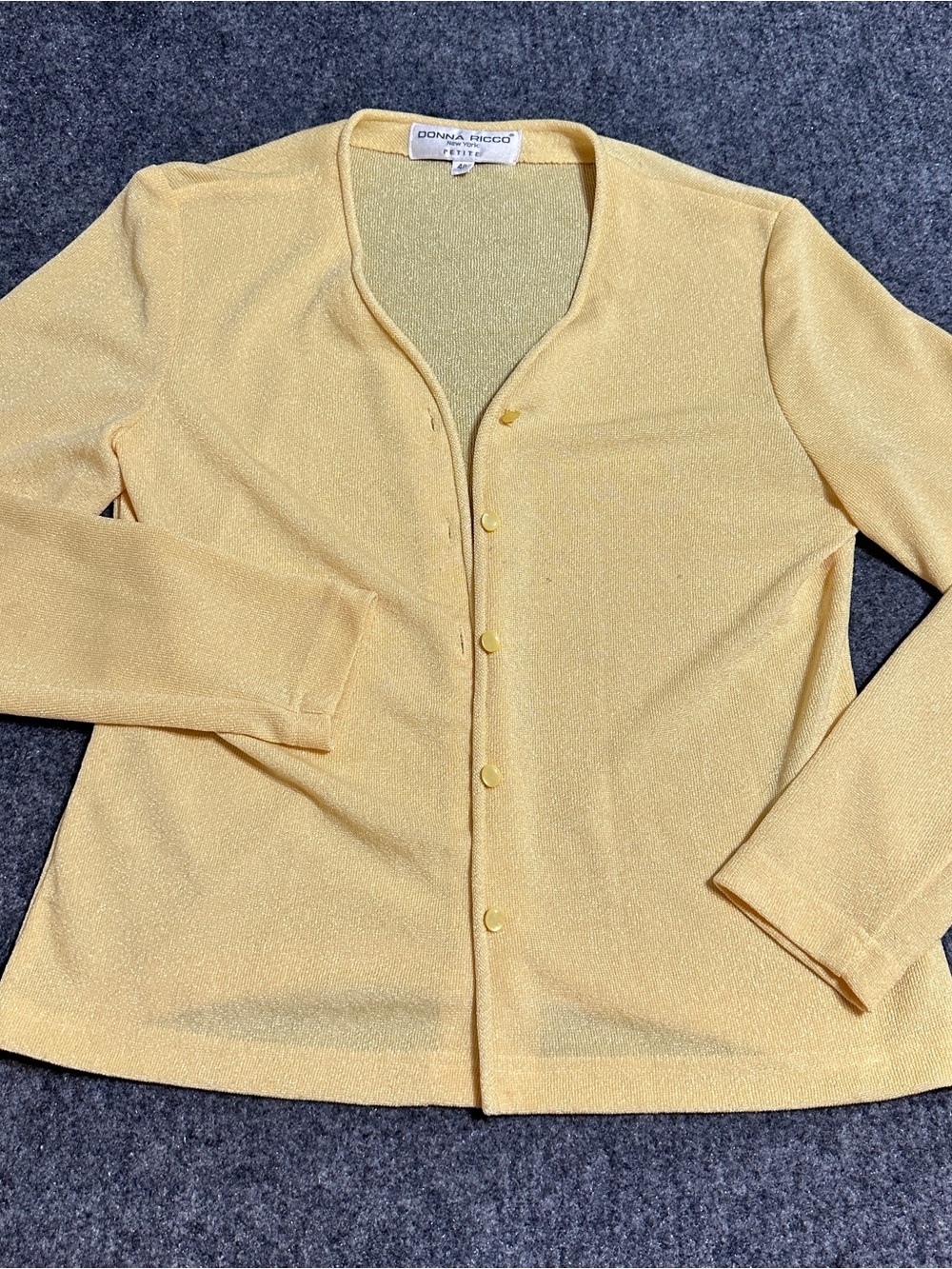 This is a vintage yellow button-up cardigan from Donna Ricco New York Petite
